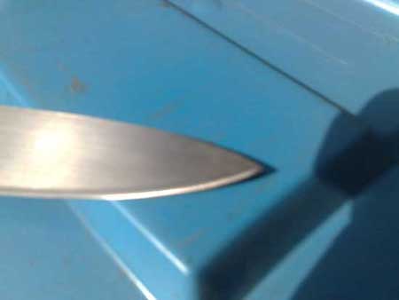 after image of knife with bent and damaged tip repaired