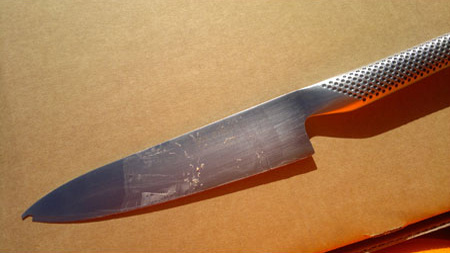 before image of knife with large chip